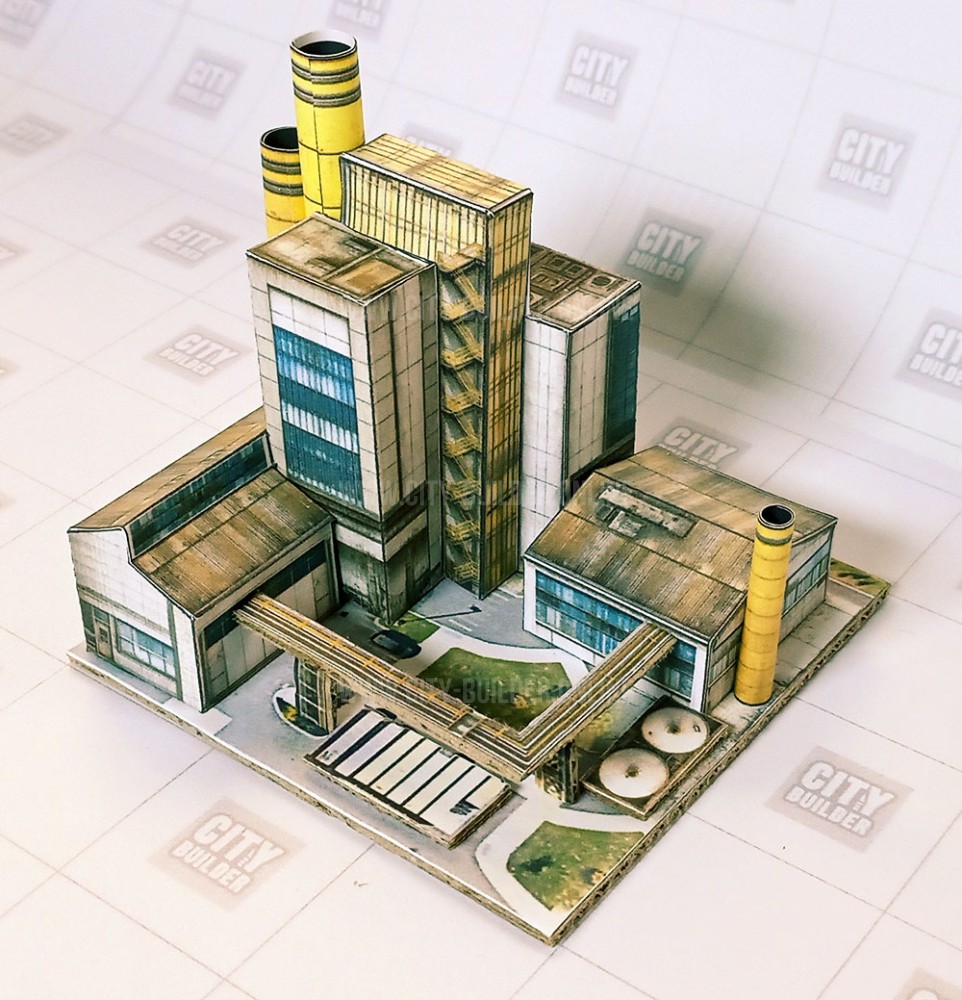 <b>A central de caldeiras industriais fornece calor e vapor de processo às fábricas e instalações de produção próximas.</b> O edifício abriga caldeiras, sistemas de troca térmica e equipamentos auxiliares, enquanto os reservatórios externos dão suporte ao